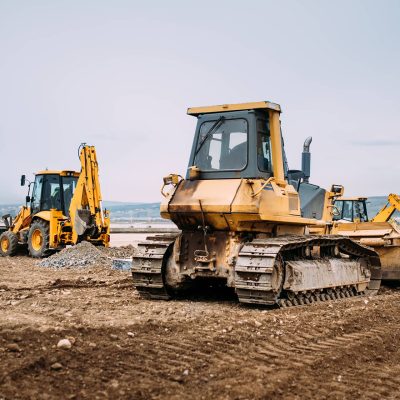 industrial-motor-grader-and-backhoe-excavator-on-h-2021-08-26-15-28-01-utc.jpg